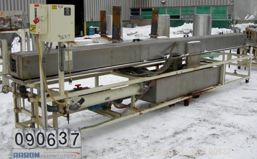 Used: Extrusion Services Inc.(ESI) spray cooling tank, 304 stainless steel. 16" wide x 11" deep x 20' long.(4) section top cover. Includes holding tank,pump, heat exchanger,and control panel. Mounted...