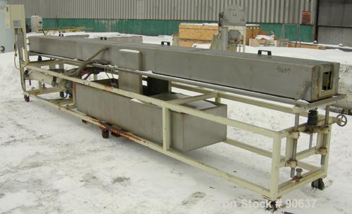 Used: Extrusion Services Inc.(ESI) spray cooling tank, 304 stainless steel. 16" wide x 11" deep x 20' long.(4) section top cover. Includes holding tank,pump, heat exchanger,and control panel. Mounted...