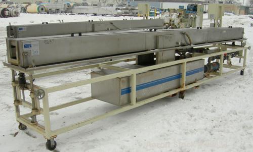 Used: Extrusion Services Inc.(ESI) spray cooling tank, 304 stainless steel. 16" wide x 11" deep x 20' long.(4) section top cover. Includes holding tank,pump, heat exchanger,and control panel. Mounted...