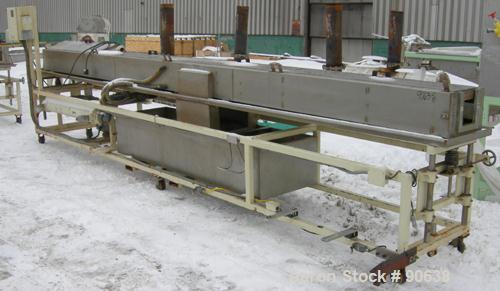 Used: Extrusion Services Inc.(ESI) spray cooling tank,304 stainless steel. 16" wide x 11" deep x 20' long.(4) section top cover. Includes holding tank,pump, heat exchanger,and control panel. Mounted ...