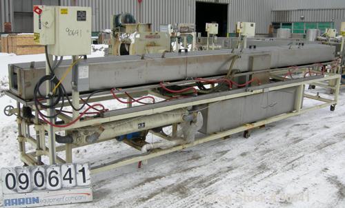 Used: Extrusion Services Inc.(ESI) spray cooling tank, 304 stainless steel. 16" wide x 11" deep x 20' long.(4) section top cover. Includes holding tank,pump, heat exchanger,and control panel. Mounted...