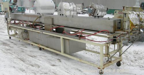 Used: Extrusion Services Inc.(ESI) spray cooling tank, 304 stainless steel. 16" wide x 11" deep x 20' long.(4) section top cover. Includes holding tank,pump, heat exchanger,and control panel. Mounted...