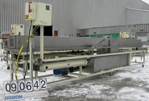 Used: Extrusion Services Inc.(ESI) spray cooling tank, 304 stainless steel. 16" wide x 11" deep x 20' long.(4) section top cover. Includes holding tank,pump, heat exchanger,and control panel. Mounted...