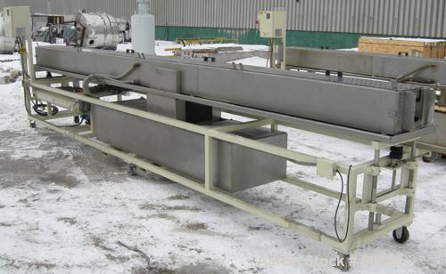 Used: Extrusion Services Inc.(ESI) spray cooling tank, 304 stainless steel. 16" wide x 11" deep x 20' long.(4) section top cover. Includes holding tank,pump, heat exchanger,and control panel. Mounted...