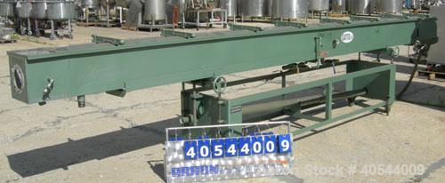Used Gatto spray cooling tank, model WST105B21-2, 304 stainless steel. (4) compartment, 12" wide x 252" long x 12" deep. (4) piece top cover, (4) spray pipes with nozzles, 20' long. Mounted on a carb...