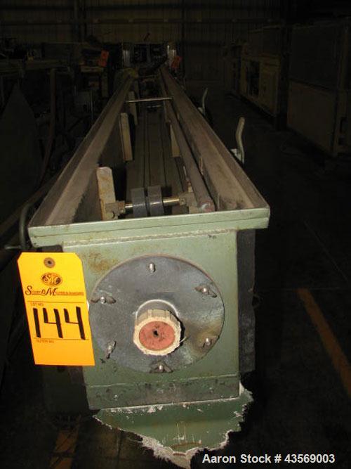 Used Gatto Cooling Tank, Approximately 12' Long. Includes pump and reservoir.