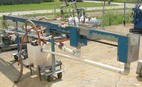 Used Merrit Davis Waterbath, 304 Stainless Steel.5 1/2" wide x 156" long x 3 7/8" deep.Includes an approximate 3/4 hp pump and plastic holding tank.Mounted on a carbon steel frame with wheels.
