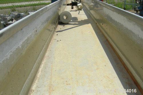 Used Merrit Davis Waterbath, 304 Stainless Steel.5 1/2" wide x 156" long x 3 7/8" deep.Includes an approximate 3/4 hp pump and plastic holding tank.Mounted on a carbon steel frame with wheels.