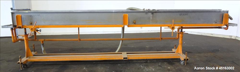 Used OEM Water Tank, 304 Stainless Steel, 185" long x 12" wide x 12" deep. Mounted on a carbon steel frame with casters.