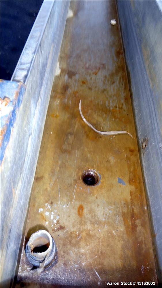 Used OEM Water Tank, 304 Stainless Steel, 185" long x 12" wide x 12" deep. Mounted on a carbon steel frame with casters.