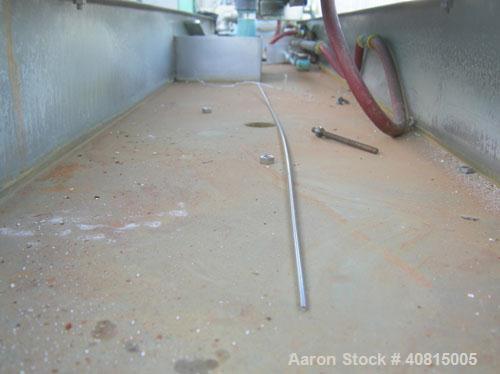 Used RDN Vacuum Sizing Tank, Model 20 P.V.S., 304 Stainless Steel.  6 1/2" wide x 6" deep x 96" long.  (1) 75" long section with cover.   Includes a holding tank, heat exchanger and pump.  Mounted on...