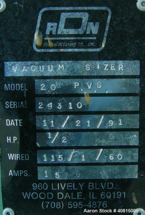 Used RDN Vacuum Sizing Tank, Model 20 P.V.S., 304 Stainless Steel.  6 1/2" wide x 6" deep x 96" long.  (1) 75" long section with cover.   Includes a holding tank, heat exchanger and pump.  Mounted on...