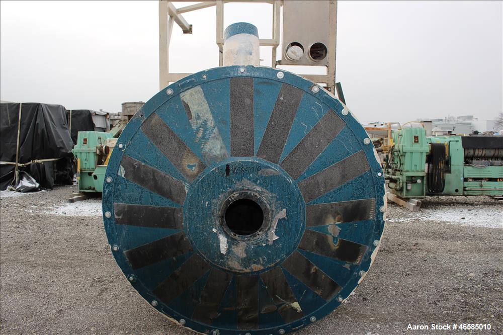 Used Drying Hopper, Approximately 8,000 Lbs. Capacity. Approximate 72" diameter x 120" straight side x 26" long cone. 30" x 30" Side access door. Openings top: (1) 10", side: (2) 10". Mounted on carb...