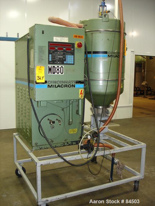 USED: Cincinnati Milacron Dryer, model DD-100. Temp range approximately 170 to 250 deg F. Air flow approximately 75 cfm. 3/60/460 volt, 14 amp. Includes an insulated hopper. Mounted on a frame with c...