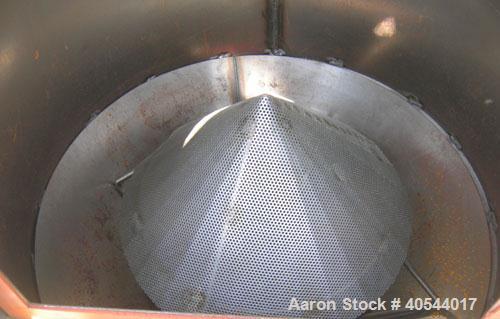 Used Conair insulated drying hopper, carbon steel, model 1805390300. 26" diameter x 46" straight side. Top mounted loader, side access door. Mounted on a frame.