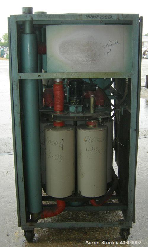 Used Conair dehumidifying dryer, model CD800, 600 cfm. 5 desiccant cartridges. 3/60/480 volt. Includes Compudry control panel, and a model 1805190800SP insulated drying hopper, 44" diameter x 65" str...