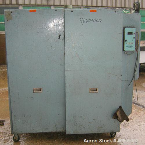 Used Conair dehumidifying dryer, model CD800, 600 cfm. 5 desiccant cartridges. 3/60/480 volt. Includes Compudry control panel, and a model 1805190800SP insulated drying hopper, 44" diameter x 65" str...