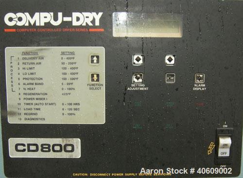 Used Conair dehumidifying dryer, model CD800, 600 cfm. 5 desiccant cartridges. 3/60/480 volt. Includes Compudry control panel, and a model 1805190800SP insulated drying hopper, 44" diameter x 65" str...