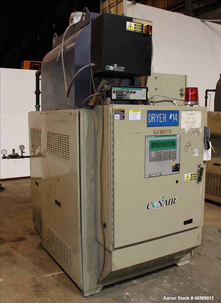 Used Conair Carousel Dehumidifying Dryer, Gas Heated, Model CDG1000, Carbon Steel. Approximate 925 CFM, drying temperature range 160 to 250 degrees F. (5) Desiccant cartridges. Includes CDG1000 Compu...