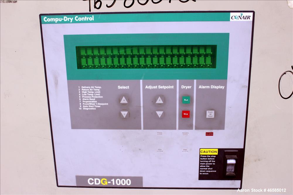 Used Conair Carousel Dehumidifying Dryer, Gas Heated, Model CDG1000, Carbon Steel. Approximate 925 CFM, drying temperature range 160 to 250 degrees F. (5) Desiccant cartridges. Includes CDG1000 Compu...