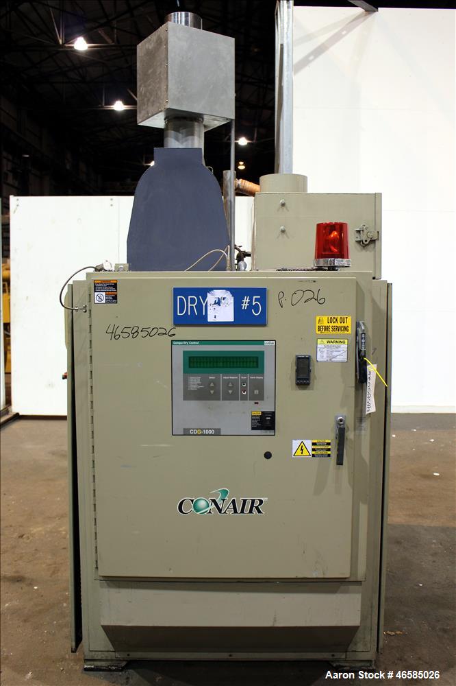 Used Conair Carousel Dehumidifying Dryer, Gas Heated, Model CDG1000, Carbon Steel. Approximate 925 CFM, drying temperature range 160 to 250 degrees F. (5) Desiccant cartridges. Includes CDG1000 Compu...