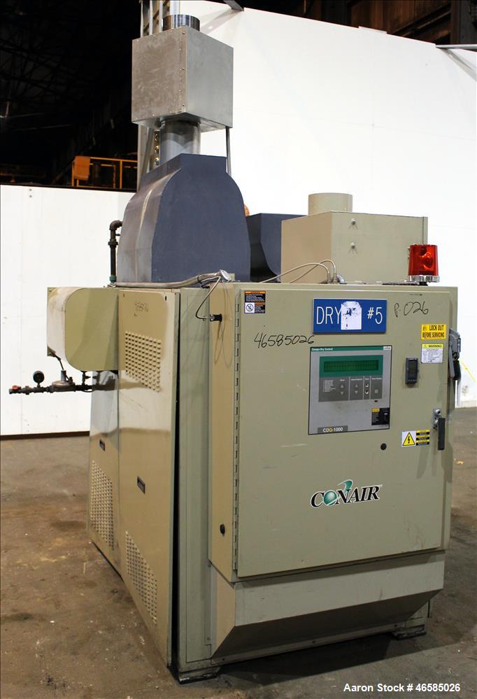 Used Conair Carousel Dehumidifying Dryer, Gas Heated, Model CDG1000, Carbon Steel. Approximate 925 CFM, drying temperature range 160 to 250 degrees F. (5) Desiccant cartridges. Includes CDG1000 Compu...