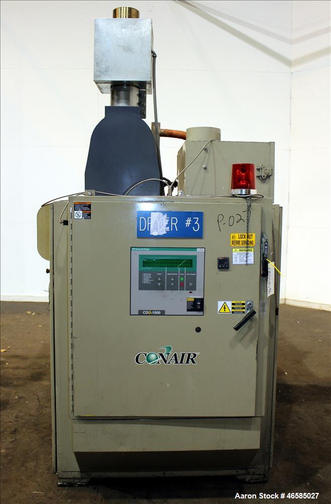 Used Conair Carousel Dehumidifying Dryer, Gas Heated, Model CDG1000, Carbon Steel. Approximate 925 CFM, drying temperature range 160 to 250 degrees F. (5) Desiccant cartridges. Includes CDG1000 Compu...