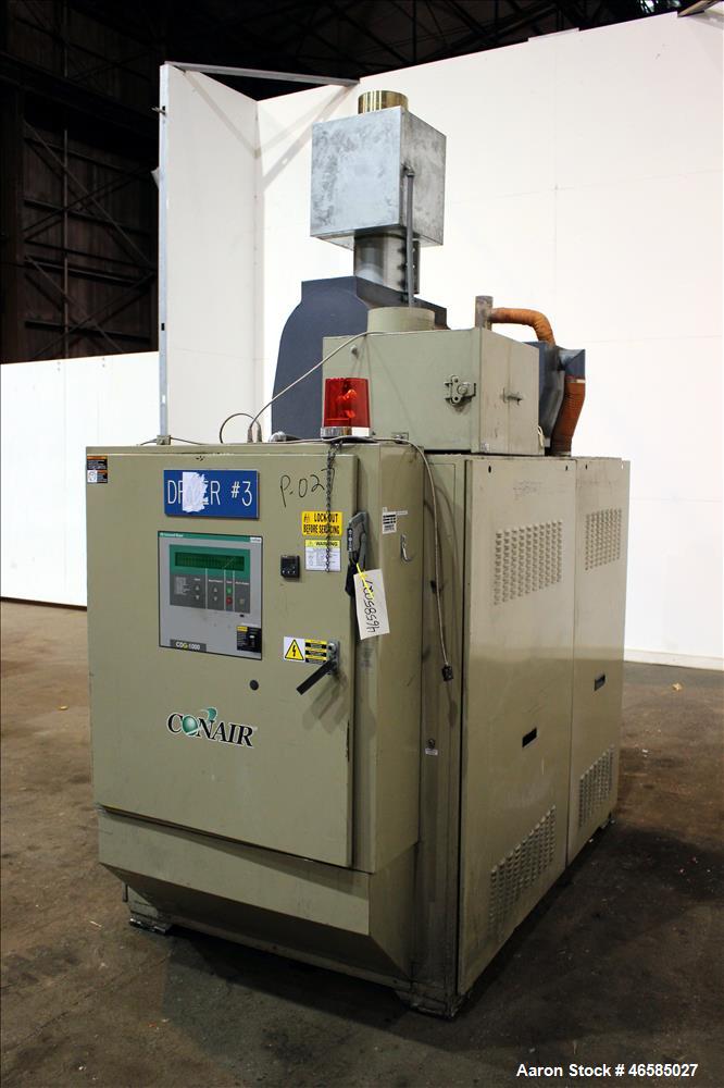 Used Conair Carousel Dehumidifying Dryer, Gas Heated, Model CDG1000, Carbon Steel. Approximate 925 CFM, drying temperature range 160 to 250 degrees F. (5) Desiccant cartridges. Includes CDG1000 Compu...