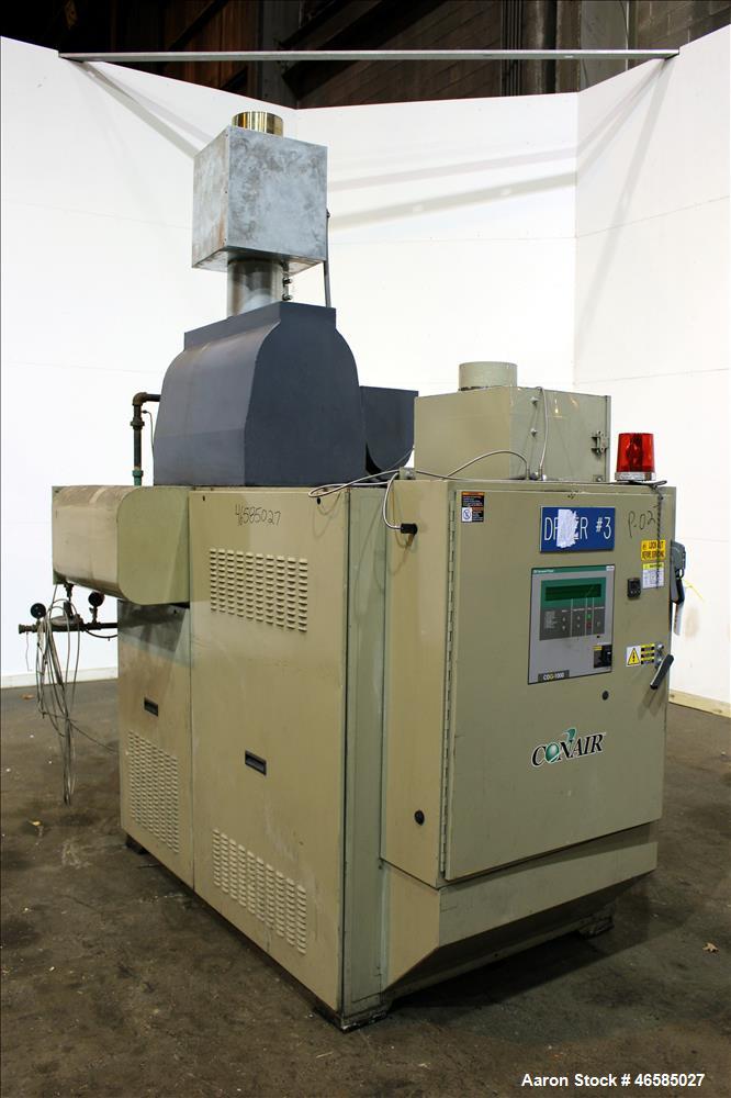 Used Conair Carousel Dehumidifying Dryer, Gas Heated, Model CDG1000, Carbon Steel. Approximate 925 CFM, drying temperature range 160 to 250 degrees F. (5) Desiccant cartridges. Includes CDG1000 Compu...