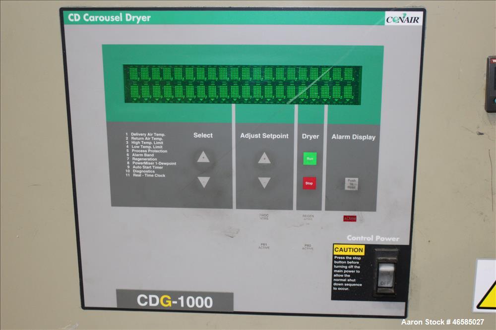 Used Conair Carousel Dehumidifying Dryer, Gas Heated, Model CDG1000, Carbon Steel. Approximate 925 CFM, drying temperature range 160 to 250 degrees F. (5) Desiccant cartridges. Includes CDG1000 Compu...