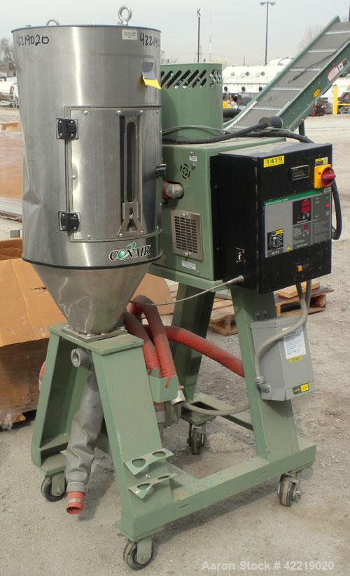 Used Conair Small Carousel Dehumidifying Dryer, model SC7.5, carbon steel, 7.5 cfm. Drying temperature range 150-375 deg F. 3/60/240 volt, 14.7 amp. Includes control panel, blower, and a model CH14-2...