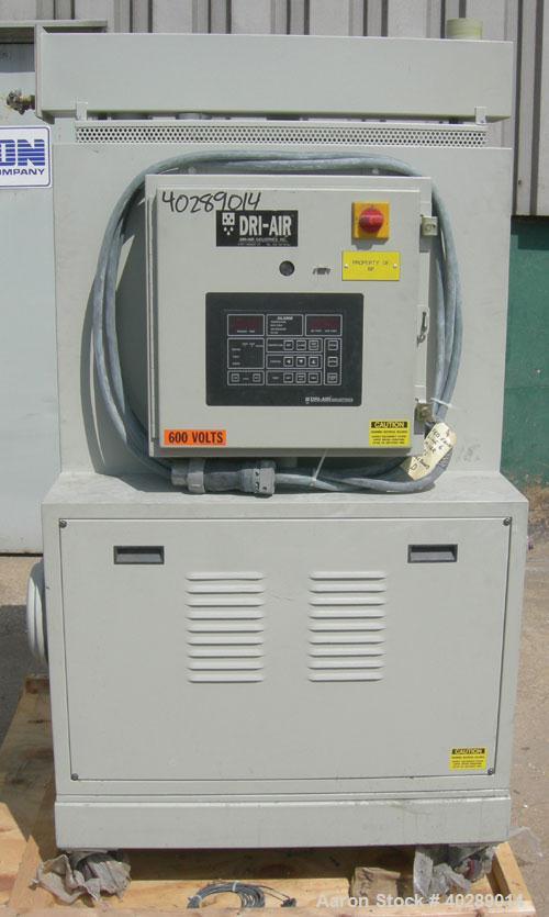 Used Dri Air desiccant dryer, model HP4-X 150. Rated 150 cfm. 3/575/25 amp. Includes a Dri-Air 400 pound 304 stainless steel insulated drying  hopper, model RH400, mounted on a stand.