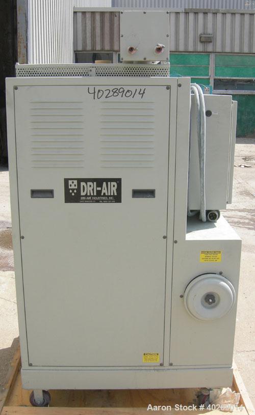 Used Dri Air desiccant dryer, model HP4-X 150. Rated 150 cfm. 3/575/25 amp. Includes a Dri-Air 400 pound 304 stainless steel insulated drying  hopper, model RH400, mounted on a stand.