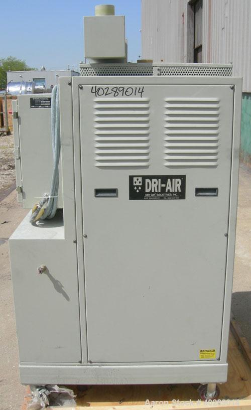 Used Dri Air desiccant dryer, model HP4-X 150. Rated 150 cfm. 3/575/25 amp. Includes a Dri-Air 400 pound 304 stainless steel insulated drying  hopper, model RH400, mounted on a stand.