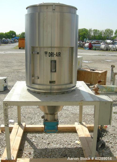 Used Dri Air desiccant dryer, model HP4-X 150. Rated 150 cfm. 3/575/25 amp. Includes a Dri-Air 400 pound 304 stainless steel insulated drying  hopper, model RH400, mounted on a stand.