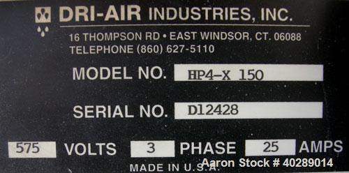 Used Dri Air desiccant dryer, model HP4-X 150. Rated 150 cfm. 3/575/25 amp. Includes a Dri-Air 400 pound 304 stainless steel insulated drying  hopper, model RH400, mounted on a stand.