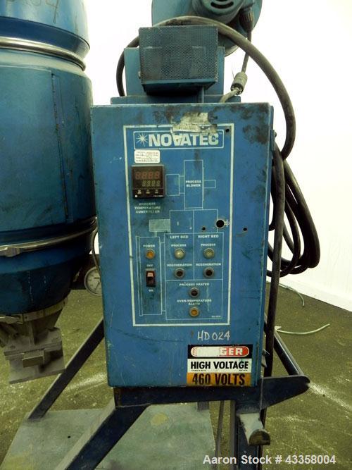 Used Novatec Micro Resin Dryer, Model MD-15. Throughput capacity 15 pounds an hour, 15 cfm. Constant -40 deg. Standard process temperature 275 degrees F. 1/60/460 volt, 2.3 kva, 4.8 amps. Unit includ...