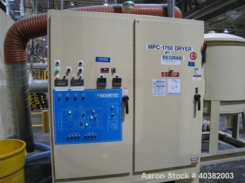 USED: Novatech modelL MPC-1750 desiccant dryer. Desiccant drying system package includes dryer, 15000 lb insulated hopper with stand, 25 hp stand alone process blower and all controls.  Material hand...