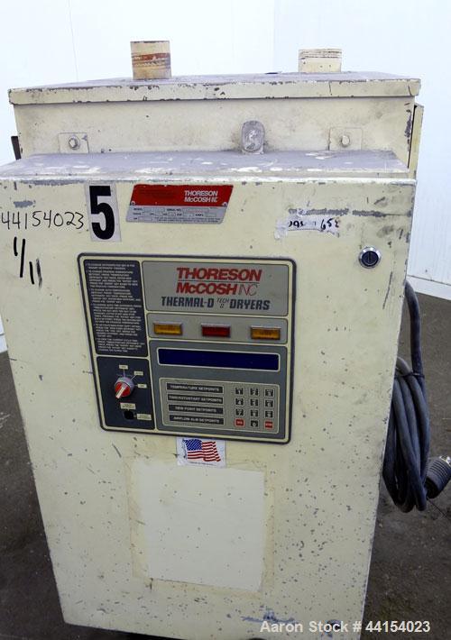 Used Thoreson McCosh Thermal-D Desiccant Dryer, Model TD 60, Carbon steel. Rated 60 CFM, 3/60/460 volt, 12 kw, 15.9 amps. Includes (2) 100# capacity hoppers mounted on a common frame.