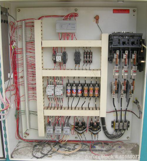 Used Unadyn Dehumidifier Dryer, model DHD-11. Dual desiccant beds, 350 process cfm, 3/60/230 volt, 106 amp, 42 kva. Includes a control panel, approximately 1500 pound drying hopper with stand and a f...