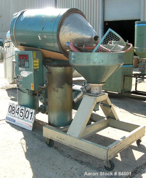 Used Una-Dyn Desiccant Dryer, Model DHD4. Process cfm 125. Temperature range 170-250 deg F, 3/60. Includes a 600 pound dryer hopper. Mounted on a frame with casters.