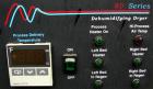 USED: AEC Whitlock WD Series dehumidifying dryer, model WD50FR. 3/60/460 volt, 50 cfm process air flow, 19 full load amps, 3/4 hp blower motor, 15.05 kva. Includes Level 1 controls. Mounted on caster...