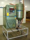 USED: Cincinnati Milacron Dryer, model DD-100. Temp range approximately 170 to 250 deg F. Air flow approximately 75 cfm. 3/60/460 volt, 14 amp. Includes an insulated hopper. Mounted on a frame with c...