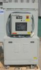 Used Dri Air desiccant dryer, model HP4-X 150. Rated 150 cfm. 3/575/25 amp. Includes a Dri-Air 400 pound 304 stainless steel insulated drying  hopper, model RH400, mounted on a stand.