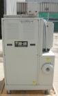Used Dri Air desiccant dryer, model HP4-X 150. Rated 150 cfm. 3/575/25 amp. Includes a Dri-Air 400 pound 304 stainless steel insulated drying  hopper, model RH400, mounted on a stand.