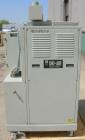Used Dri Air desiccant dryer, model HP4-X 150. Rated 150 cfm. 3/575/25 amp. Includes a Dri-Air 400 pound 304 stainless steel insulated drying  hopper, model RH400, mounted on a stand.