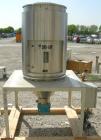 Used Dri Air desiccant dryer, model HP4-X 150. Rated 150 cfm. 3/575/25 amp. Includes a Dri-Air 400 pound 304 stainless steel insulated drying  hopper, model RH400, mounted on a stand.