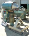 Used Una-Dyn Desiccant Dryer, Model DHD4. Process cfm 125. Temperature range 170-250 deg F, 3/60. Includes a 600 pound dryer hopper. Mounted on a frame with casters.