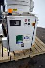 Used Una-Dyn Closed Circuit Crystallizer, Model XTLR-600, Carbon Steel. Approximate through-put 600 pounds per hour. Includes an insulated drying hopper, agitator arm assembly with motor, 5hp blower,...