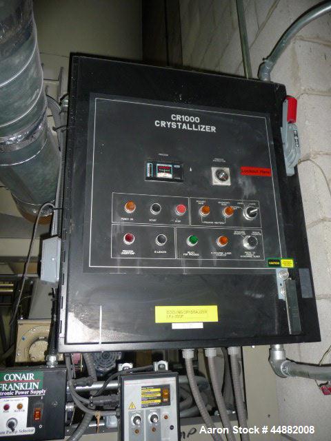 Used Conair Model CR1000 Crystallizer rated at 1000 lbs per hour.  Includes approximately 3500 lb agitated hopper, operator control panel and heater / cooler unit with blower.